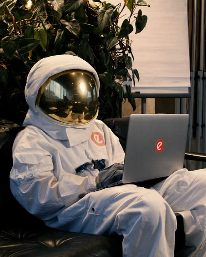 A astronout from epunkt on a laptop